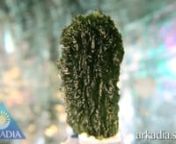 Item Code: IM024nMetric Dimensions: 47 x 28 x 16 mmnImperial Dimensions: 1 7/8 x 1 1/8 x 5/8 inchesnWeight: 99.5 Carats (19.9 grams)nnThis big 19.9 gram Moldavite exhibits gorgeous flowing texture with sharp spikes around the edges. The half-drop shape was most likely initially given form during its second descent from the skies after an epic meteor collision around twelve million years ago - the first being the meteor itself which struck with such force it threw huge amounts of material back in