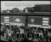 1947., USAnn[Post-WWII - 1947, Aid For France re Friendship Train]nHA crowd on railroad platform as box cars labeled Friendship Train pull into station.LS steam engine pulling freight train.MCU signs on carswriting signs; loading train cars.n04:44:39Night.Diesel engine pulling train along street thru town w/ lighted store fronts.n04:44:58DaytimeWW2 Assistance; Promotion; Publicity; Cold War; nNOTE:Good quality image but has printer ride.nNOTE:Idea initiated by columnist Drew