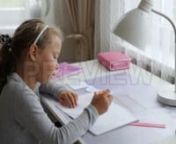 Get 100&#39;s of FREE Video Templates, Music, Footage and More at Motion Array: http://bit.ly/2SITwWM nnnGet this here: https://motionarray.com/stock-video/girl-doing-her-homework-177798nnGirl Doing Her Homework is an awesome stock video that displays a side view shot of a young Caucasian girl doing homework while sitting in her room. This 1920x1080 (HD) bit of video is apt to use in any project that depicts education, school, studies, children, etc. Grab this footage today, and add it to your next