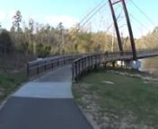 Late Evening Thursday 03-24-2016, 7:40 into my video, approaching cyclist does U-turn, mile post 15-1/4. (Note Great Blue Heron above.)nnI edited out about 5 minutes between the videi start, and the U-turn.nnEvening is so warm, greenway patrons are in short-sleeves and shorts.nnThis old man (74-1/2) gets foolish again. Riding 56 pounds of steel bicycle from Target, including my bicycle trunk holding 12 pounds of spare parts, first aid and camera gear, I will happily consume some extra calories