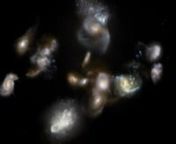 This artist’’s impression video shows a group of interacting and merging galaxies in the early Universe. Such mergers have been spotted using the ALMA and APEX telescopes and represent the formation of galaxies clusters, the most massive objects in the modern Universe. Astronomers thought that these events occurred around three billion years after the Big Bang, so they were surprised when the new observations revealed them happening when the Universe was only half that age!nCredit: ESO/M. Ko