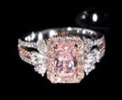 A gorgeous ring featuring a 1.00 carat fancy light pink GIA certified diamond, 6 pear cut white diamonds (0.48 carats total) and 80 white and pink side stones (0.52 carats total)