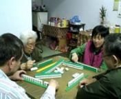 Two of my uncles, an aunt, and my grandmother playing a game of Mahjong at my grandmother&#39;s house in Xindian City, Taiwan.