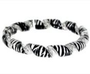 https://www.ross-simons.com/937285.htmlnnBe fierce and fun with so much style! This wild accessory is a playful statement, featuring zebra-print enamel and sterling silver in a bold, yet comfortable, twisted bangle bracelet. Made in Italy. Figure 8 safety. Hinged. Sterling silver and zebra-print enamel bangle bracelet.
