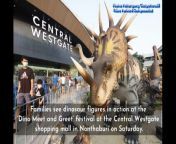 Families see dinosaur figures in action at the ‘Dino Meet and Greet’ festival at the Central Westgate shopping mall in Nonthaburi on Saturday. Visitors can get up close and personal with the moving dinosaurs. (Photos: Pattarapong Chatpattarasill)&#60;br/&#62;