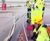Fire and Rescue team up with an SES crew to rescue a woman trapped in her car in floodwaters.&#60;br/&#62;Video via FRNSW