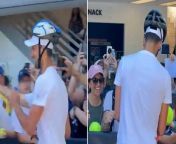 Novak Djokovic greets fans wearing a helmet after getting hit on head with water bottleSource Novak Djokovic