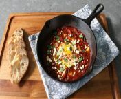 Transform your breakfast with this flavorful and fiery Shakshuka! The mouthwatering dish in this video features poached eggs nestled in a vibrant tomato and bell pepper sauce, infused with Chef John&#39;s signature spice blend. Experience a culinary adventure with each delicious bite that will leave you wanting more.