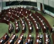Two newly elected pro-democracy Hong Kong lawmakers, barred from parliament for insulting China in their swearing-in ceremony, have set off another round of disorder by scuffling with guards as they tried to retake their oaths in the chamber.