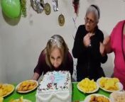 Gather &#39;round for a slice of pure hilarity! &#60;br/&#62;&#60;br/&#62;This side-splitting video, captured at the filmer, Erica&#39;s, aunt&#39;s birthday bash, proves that life is just better when we stay kids at heart. &#60;br/&#62;&#60;br/&#62;Amidst the festivities, the unsuspecting birthday girl takes a dive straight into the birthday cake, wearing it like a sweet, creamy facial mask.&#60;br/&#62;&#60;br/&#62;But wait, it gets better! Instead of getting flustered, she embraces the chaos, turning her cake-smeared lips into a weapon of affection, planting cake kisses on everyone in sight!&#60;br/&#62;&#60;br/&#62;It&#39;s a riot of laughter as the guests hilariously wear their cake decorations with pride, proving that age is just a number when you&#39;ve got a playful spirit. &#60;br/&#62;&#60;br/&#62;After all, who says you can&#39;t have your cake and wear it too?&#60;br/&#62;&#60;br/&#62;&#60;br/&#62;Location: Quito, Ecuador&#60;br/&#62;WooGlobe Ref : WGA146963&#60;br/&#62;For licensing and to use this video, please email licensing@wooglobe.com